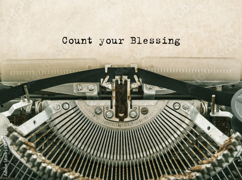 Count your Blessing typed words on a vintage typewriter. Close-up.