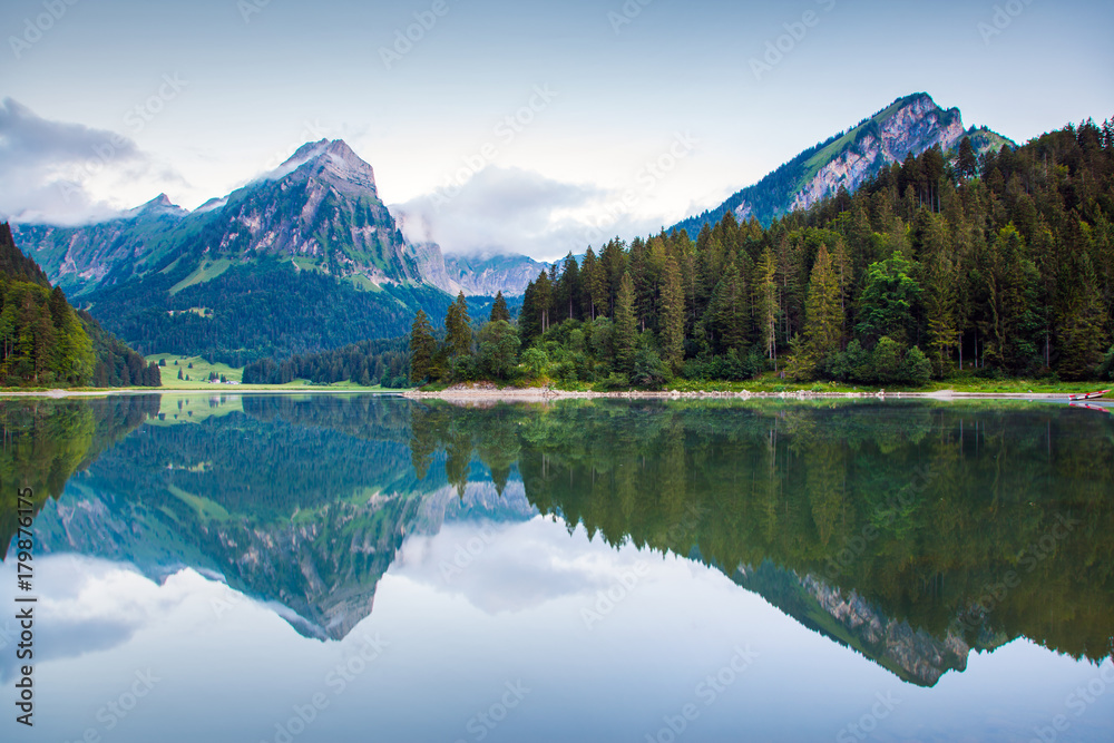 Misty summer landscape on the Obersee lake. C