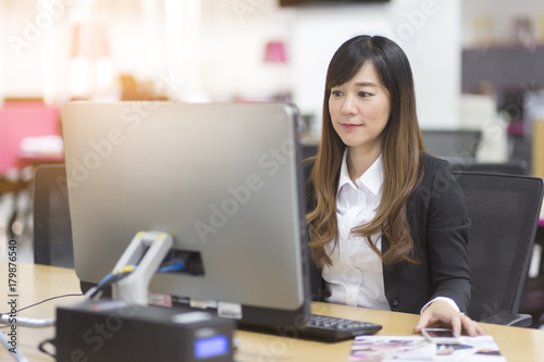 Businesswoman asian Typing On Keyboard In Office