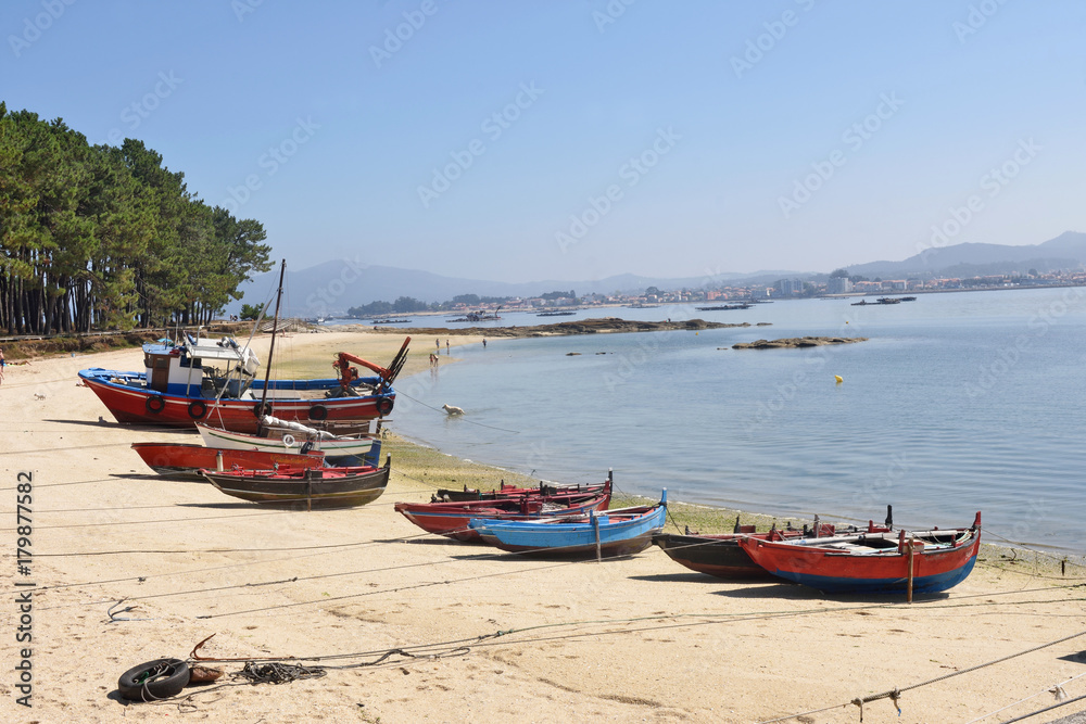 Arousa Island boats on the beach Praia Cabodeiro, Pontevedra province, Galicia, Spain