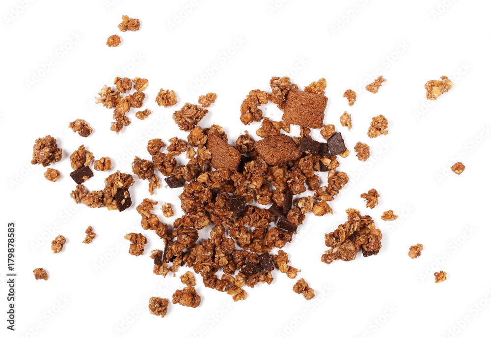Crunchy granola, muesli pile with chocolate isolated on white background, top view