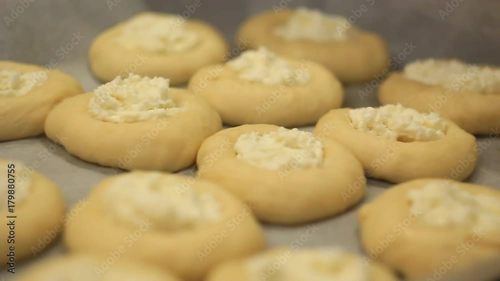girl makes of buns on the table, hands, close-up girl makes of buns on the table, hands, close-up