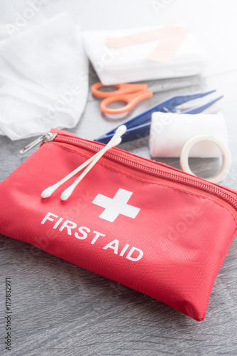 First aid medical kit on wood background,copy space