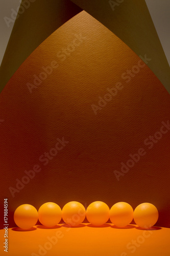 Abstract still life with orange balls on a colorful background