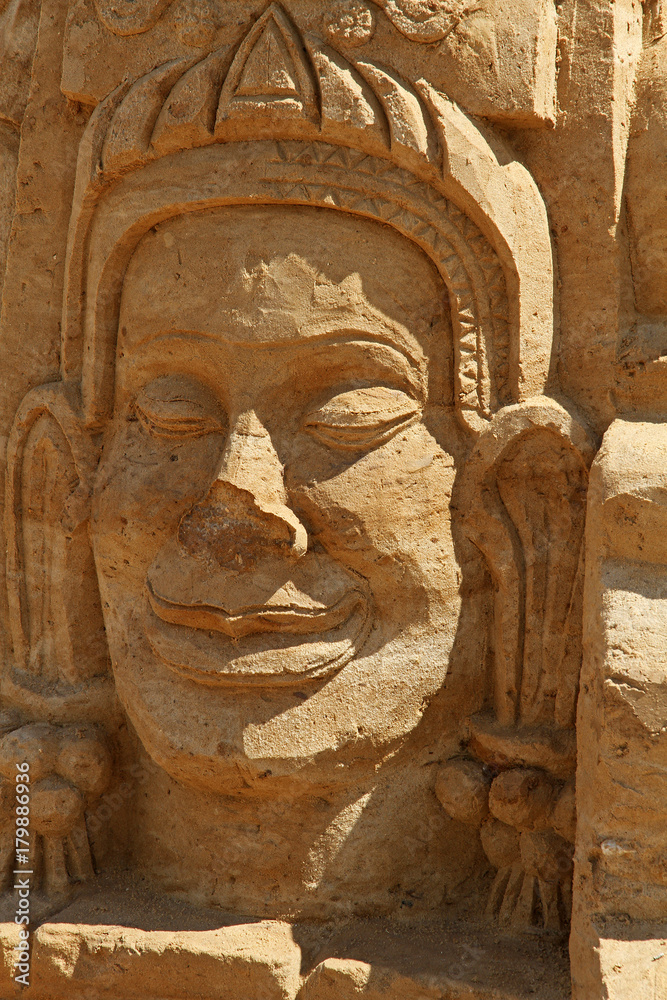 Sand sculpture man face