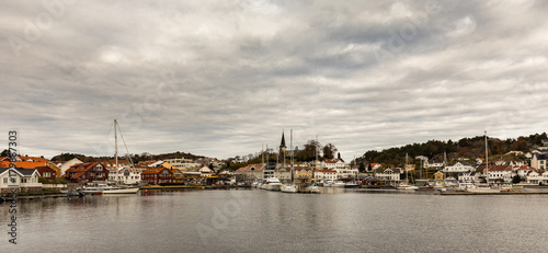 Grimstad, Norway - October 31 2017: Grimstad harbor and city seen from a distance, Norway, Europe. Panorama