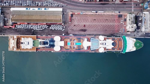 Large cruise ship docked at port - Top down aerial view