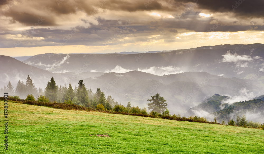 Fototapeta premium Dramatic sky at rainy day in Black Forest in Germany / Wide panoramic photo of Black Forest nearby Freudenstadt