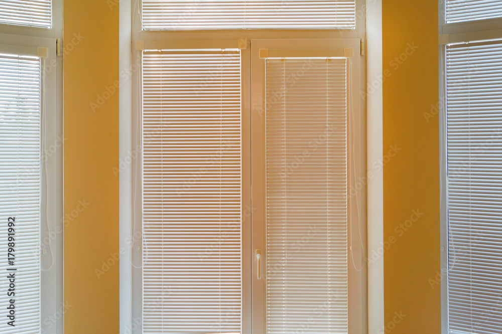 Beige horizontal jalousie in the living room Beige horizontal jalousie in the living room