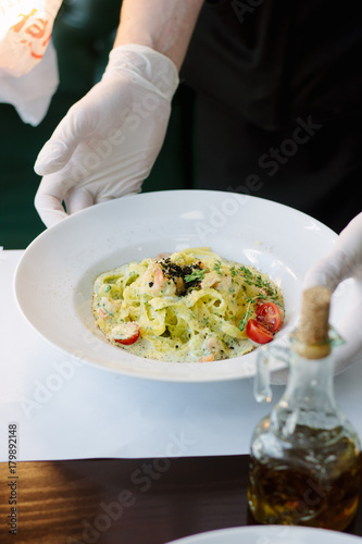 Wallpaper Mural Chief served table with plate of fettuccine pasta Torontodigital.ca