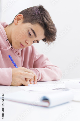 child writing and studying at the desk