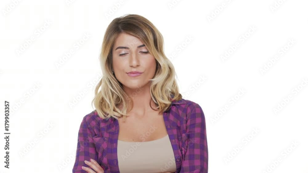 portrait of caucasian long-haired woman wearing plaid shirt being indecisive thinking what to choose hesitating over white background in studio. Concept of emotions portrait of caucasian long-haired woman wearing plaid shirt being indecisive thinking what to choose hesitating over white background in studio. Concept of emotions