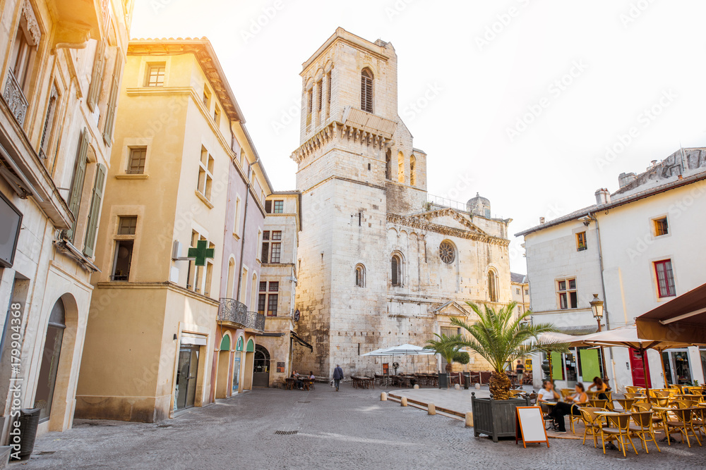 View on the saint Castor cathedral in the center of the old town of Nimes city in the Occitanie region of southern France