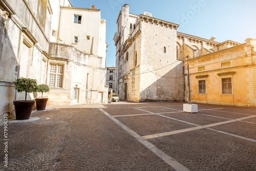 View on the saint Castor cathedral in the center of the old town of Nimes city in the Occitanie region of southern France