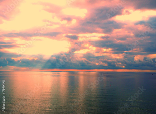 Beautiful sunrise in ocean, the bright colors of riot of colors