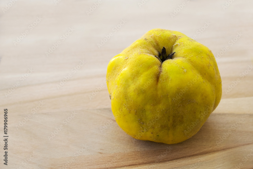 quince fruit on a wooden platter quince fruit on a wooden platter