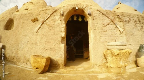 arched entrance to a clay traditional house in a village on the border of Syria and Turkey photo