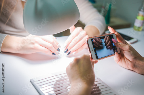 Close up of female hands having manicure