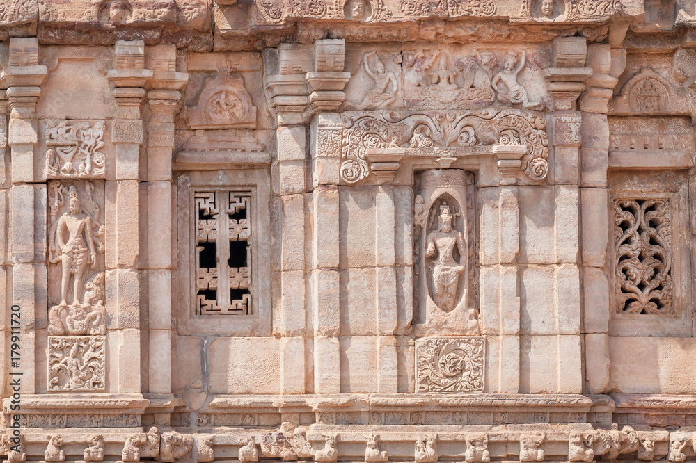 Old sculptures on ancient walls of Hindu temples, architecture landmark in Pattadakal, India. UNESCO World Heritage site
