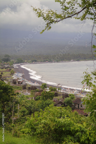 Amed,Bali Coastline. The place commonly referred to as Amed isn’t a single town but a string of quaint beachside fishing villages stretching about 15km along the dry and rugged eastern coast of Bali. photo