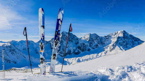 Ski in winter season, mountains and ski touring backcountry equipments on the top of snowy mountains in sunny day. South Tirol, Solda in Italy. © Gorilla