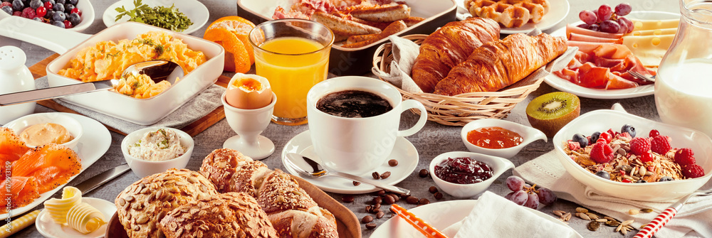 Breakfast with coffee surrounded by various food - obrazy, fototapety, plakaty 