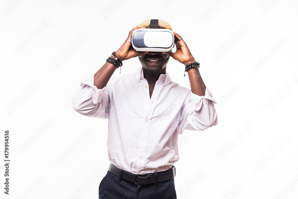 Isolated portrait of an African American young man in a hoodie wearing vr glasses and playing a video game. Isolated portrait of an African American young man in a hoodie wearing vr glasses and playing a video game.