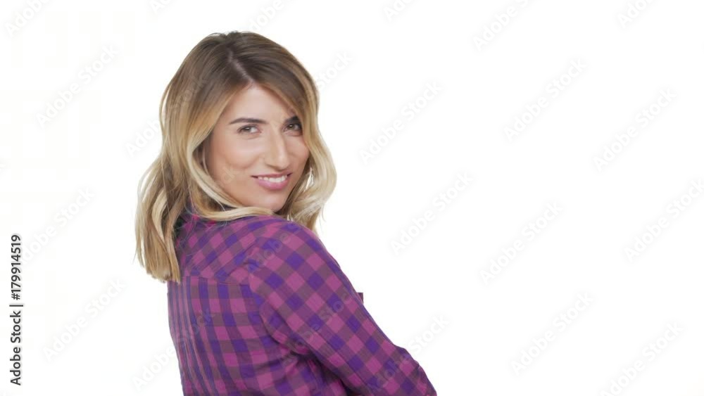 portrait from back of charming woman 30s with dyed blond hair turning around on camera with brilliant smile being flirty over background copy space. Concept of emotions portrait from back of charming woman 30s with dyed blond hair turning around on camera with brilliant smile being flirty over background copy space. Concept of emotions