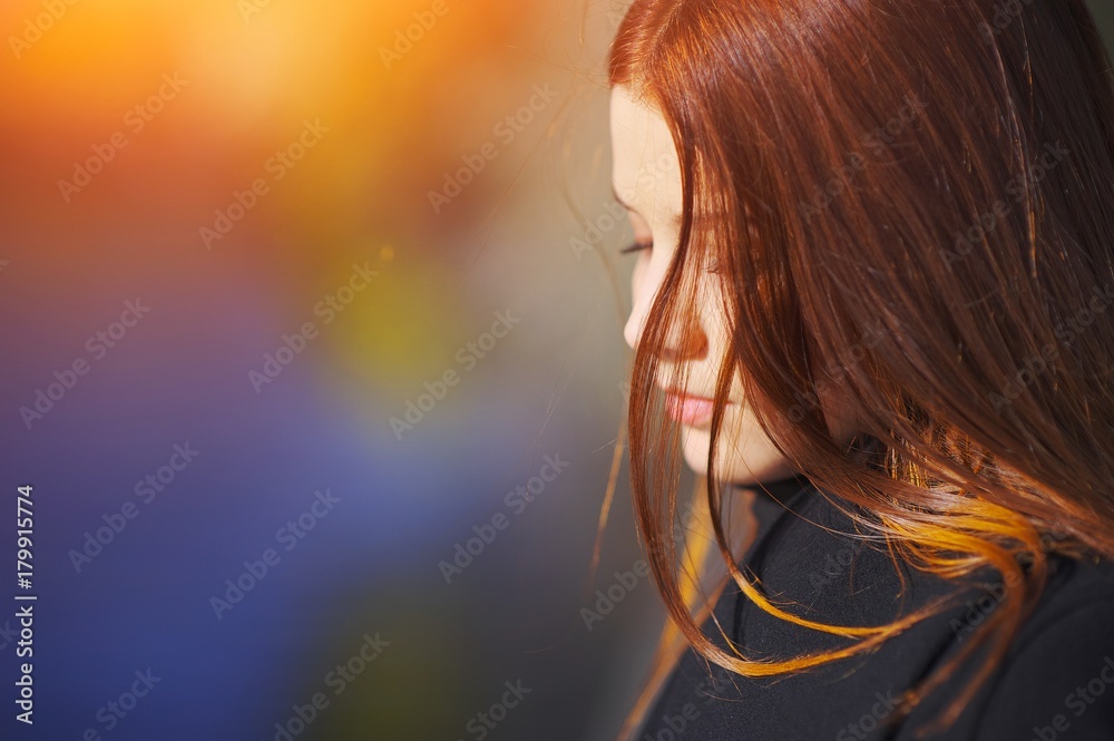 Portrait of young sad girl with beautiful hair down lowered look at blurred  background, side view, selective focus, close-up. Stock Photo | Adobe Stock