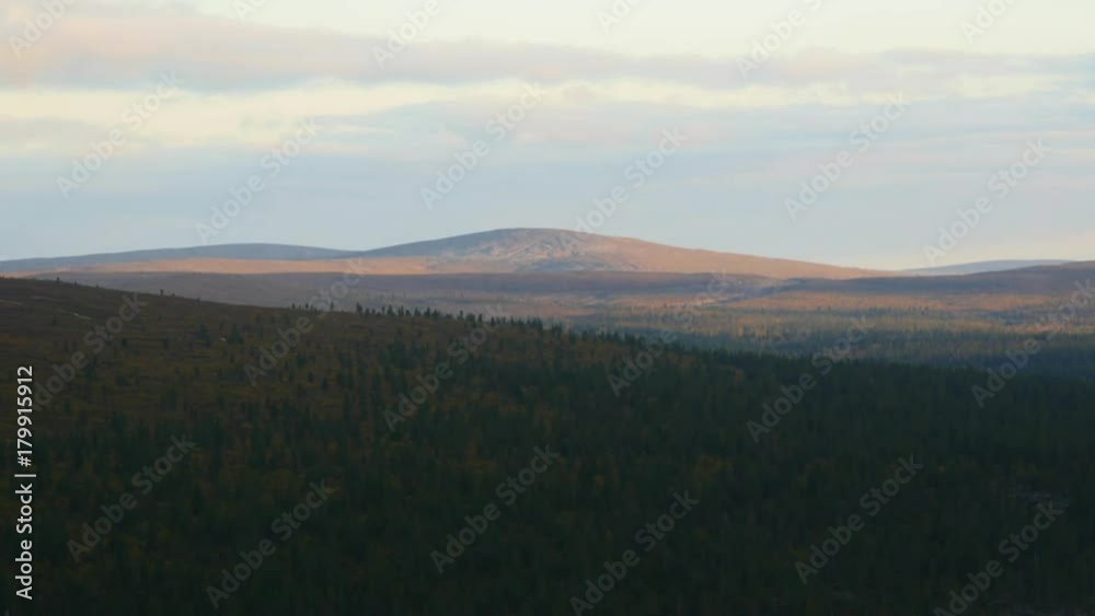 Arctic sunset, Time lapse of evening dusk sun, fading away on the top of a tunturi fjeld fell, in urho kekkonen national park, lapland, in Lappi, Finland Arctic sunset, Time lapse of evening dusk sun, fading away on the top of a tunturi fjeld fell, in urho kekkonen national park, lapland, in Lappi, Finland