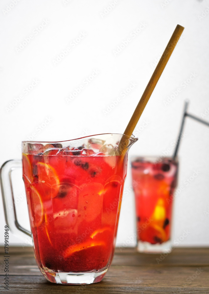 Homemade lemonade with black currant in a jar on a wooden table Homemade lemonade with black currant in a jar on a wooden table