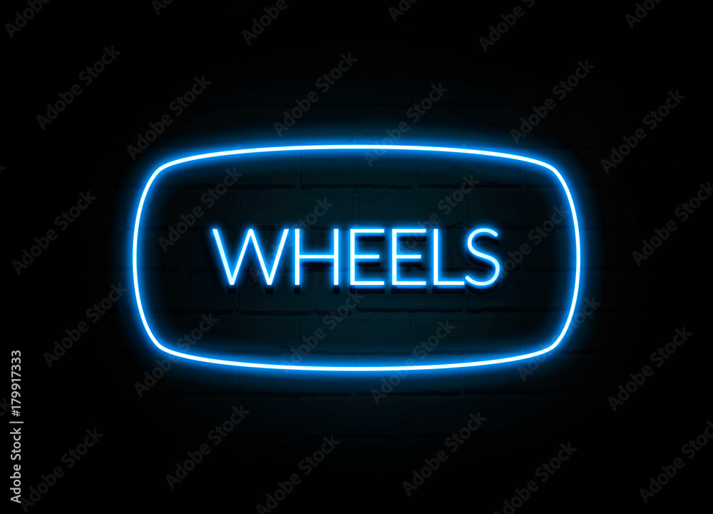 Wheels - colorful Neon Sign on brickwall Wheels - colorful Neon Sign on brickwall