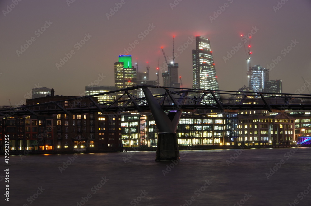 Night view of the Millennium Bridge over the Thames,