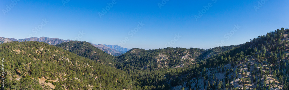 Evening light casts shadows on the tops of mountains in the southern California Angeles National Forest.