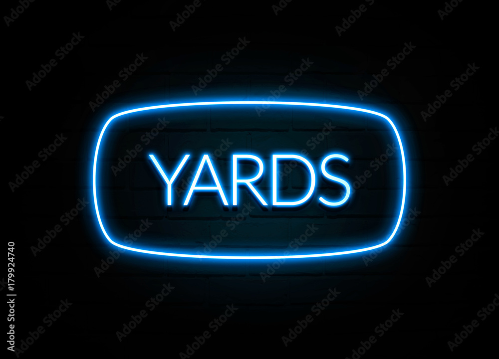 Yards - colorful Neon Sign on brickwall Yards - colorful Neon Sign on brickwall