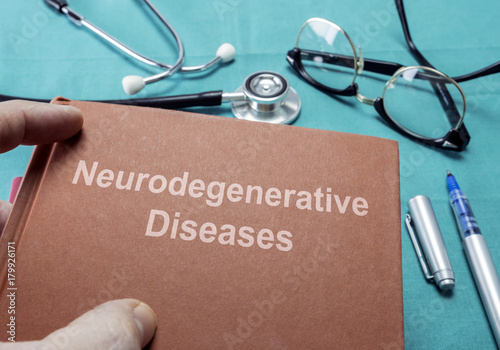  Doctor Holds Book On Neurodegenerative Diseases In A Hospital  photo