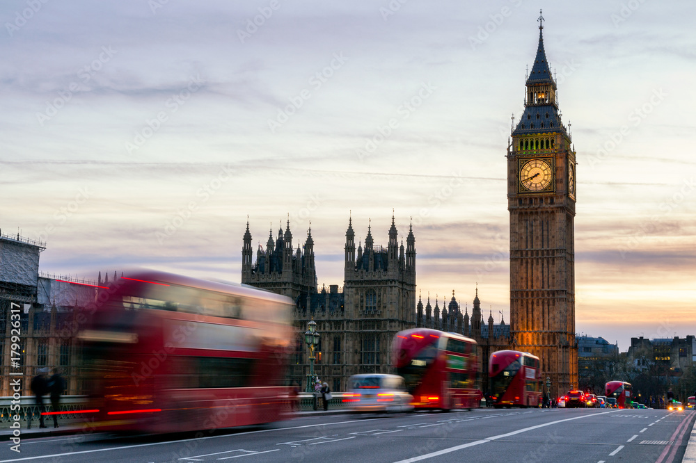 The Big Ben, House of Parliament and double-decker bus blurred in motion, London, UK