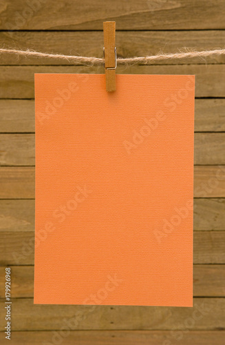 Background of Hanging Paper on a Wooden Background