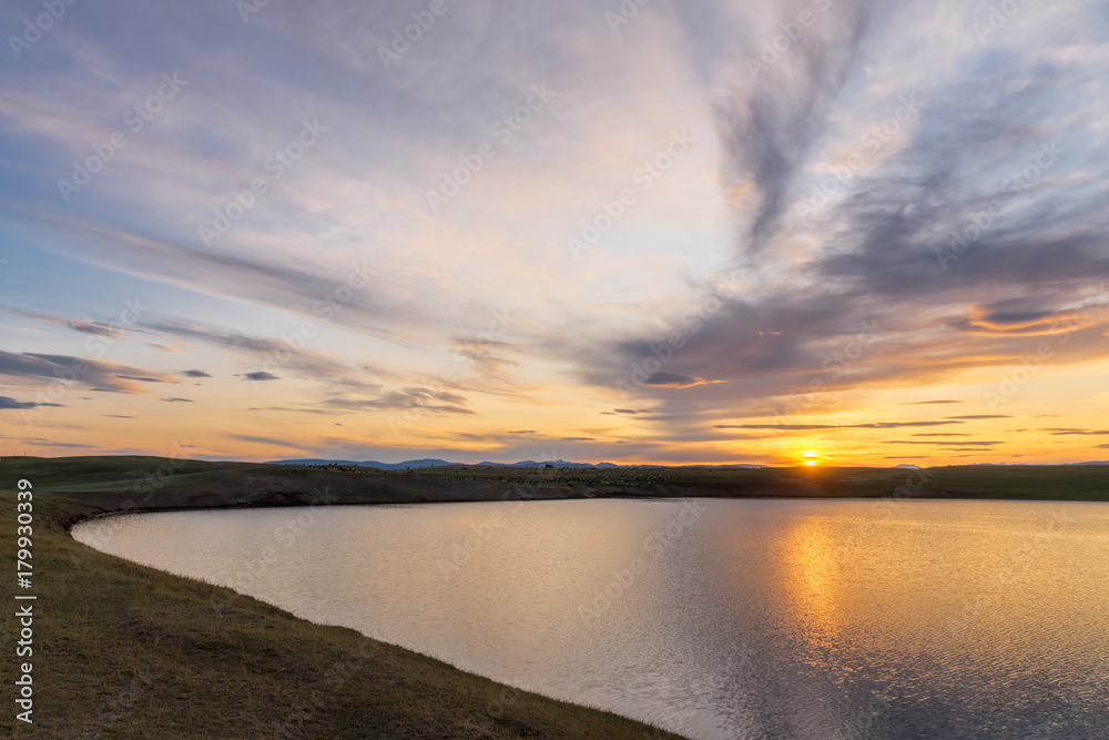 Sunset on the shore of the lake in the Darhat Valley