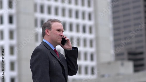 Businessman getting good news on the phone