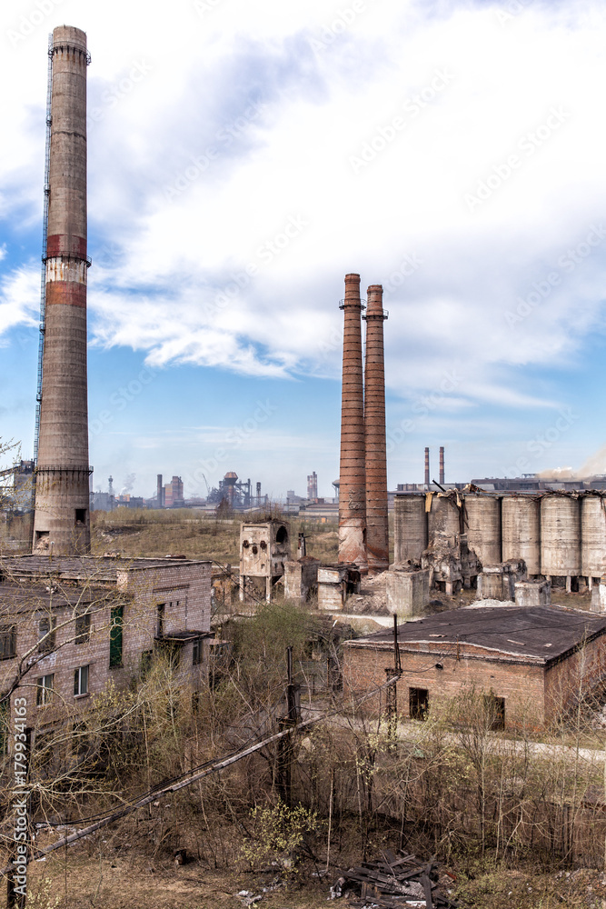 Industrial landscape. Destroyed and abandoned shops of cement and boiler-radiator plant