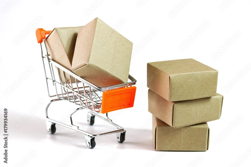 The brown box on the shopping car isolated on white background
