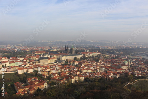 View on colorful autumn Prague City with its Towers and historical Buildings, Czech Republic