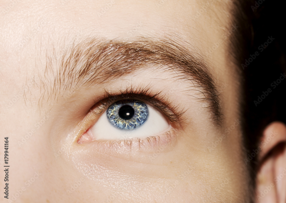 Obraz premium Image of man's blue eye