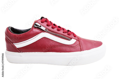 Fashion shoes with shoestring. Red sneaker and shoelace on white background © Victoria Key