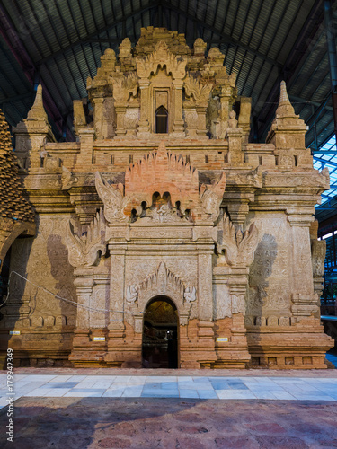 The ancient pagoda with the bas relief sculpture on the pagoda wall build by King Anawrahta at Ta Mok Shwe-gu-gyi Temple, Mandalay, Mynanmar photo