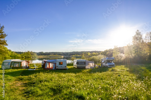 Caravans and camping on the lake. Family vacation outdoors