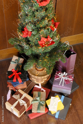 Christmas tree with many ccolorful gifts photo