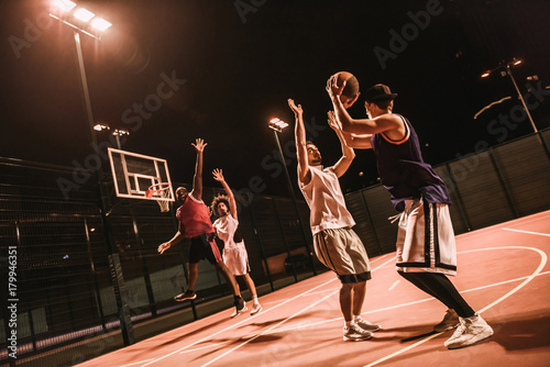 Guys playing basketball © georgerudy