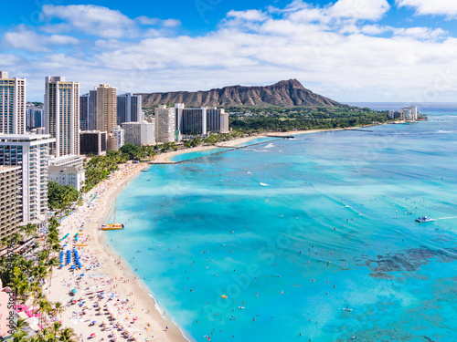 Waikiki Beach and Diamond Head Crater including the hotels and buildings in Waikiki, Honolulu, Oahu island, Hawaii. Waikiki Beach in the center of Honolulu has the largest number of visitors in Hawaii photo